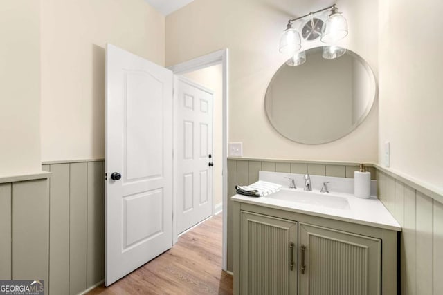 bathroom featuring vanity and hardwood / wood-style flooring