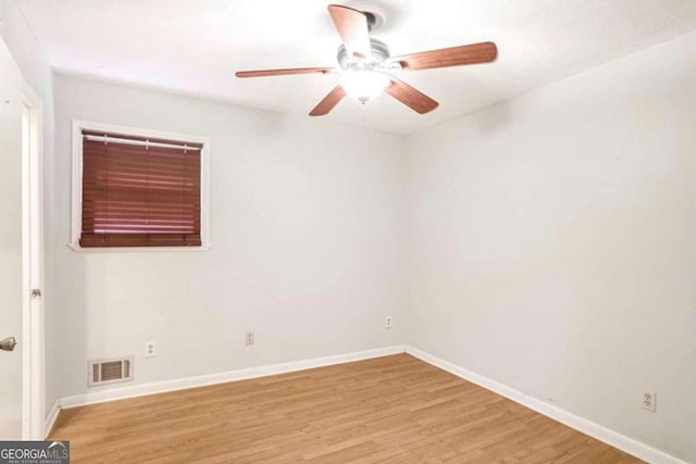 spare room featuring ceiling fan and light wood-type flooring