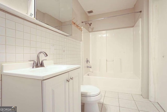 full bathroom featuring shower / tub combination, vanity, tile patterned floors, and tile walls