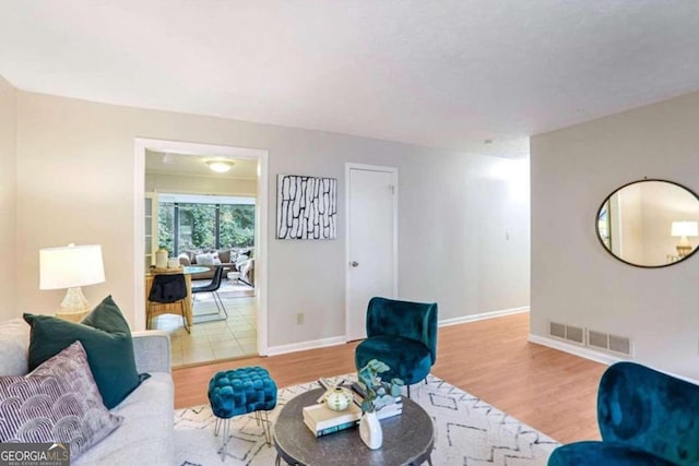 living room with light hardwood / wood-style flooring