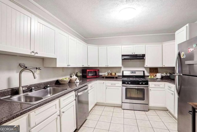 kitchen featuring white cabinetry, sink, a textured ceiling, and appliances with stainless steel finishes