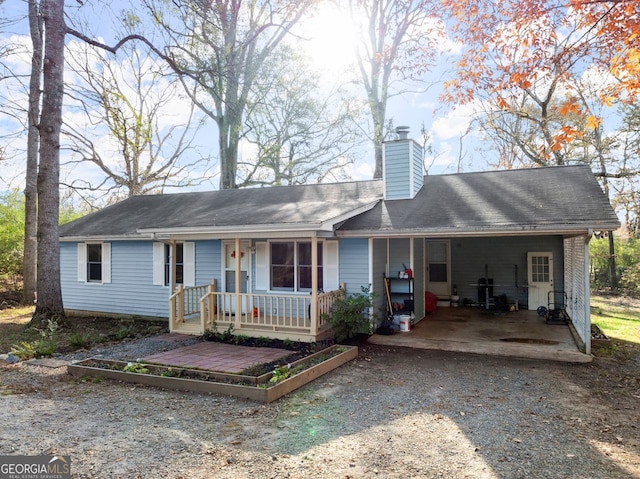 single story home featuring a carport