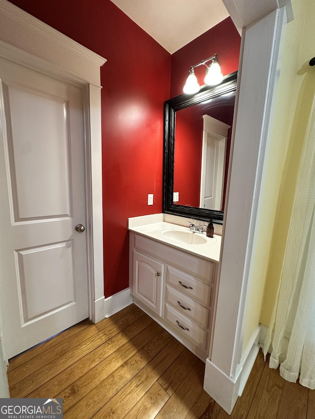 bathroom featuring hardwood / wood-style floors and vanity