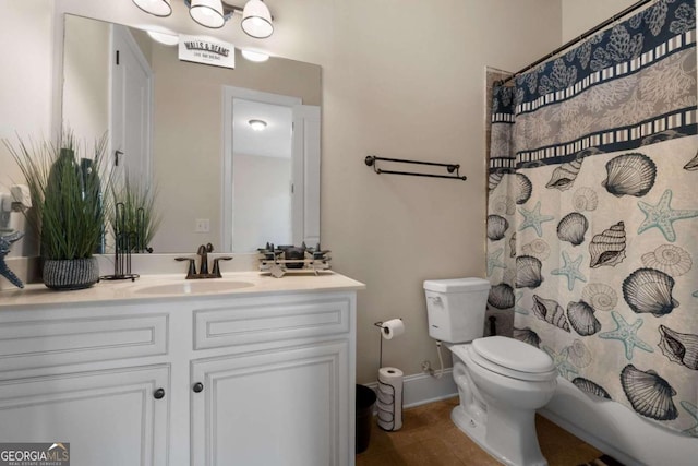 bathroom with tile patterned flooring, vanity, toilet, and curtained shower