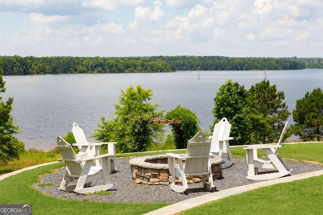 view of water feature with an outdoor fire pit