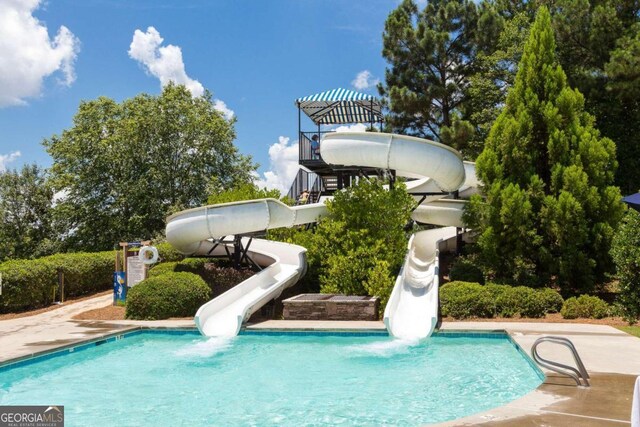 view of pool featuring a water slide