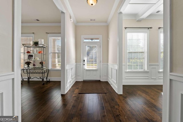 foyer with beam ceiling, crown molding, and dark hardwood / wood-style flooring