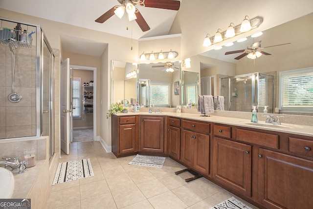 bathroom featuring vaulted ceiling, vanity, an enclosed shower, ceiling fan, and tile patterned floors