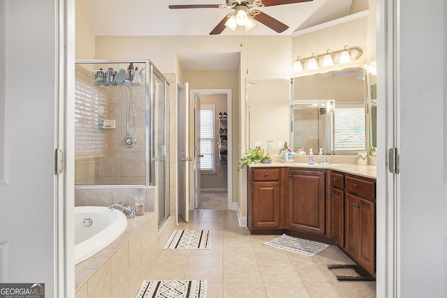 bathroom featuring shower with separate bathtub, tile patterned floors, and vanity