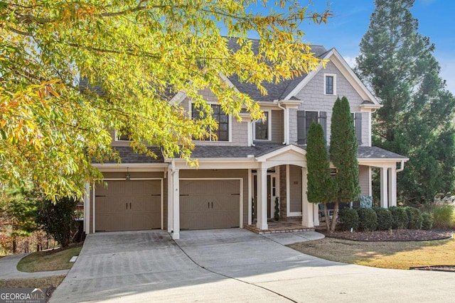 view of front of property with a garage and a porch