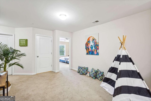 bedroom featuring light colored carpet