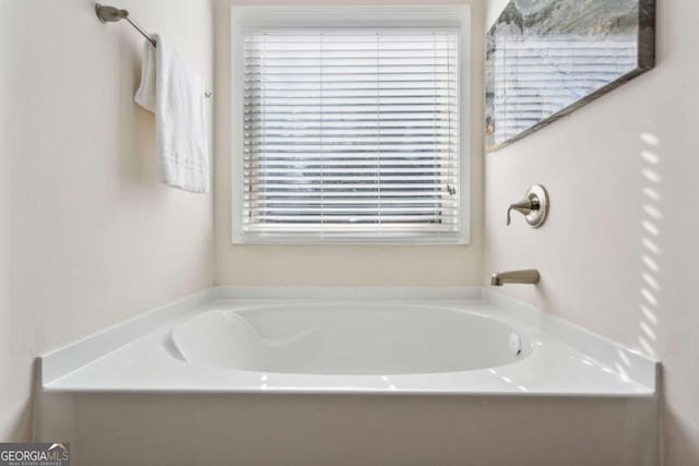 bathroom featuring a tub to relax in