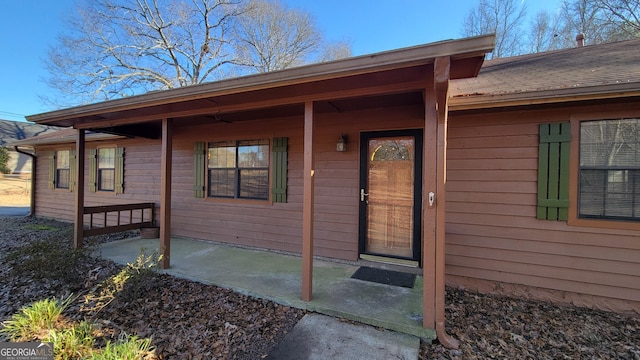 entrance to property with a patio