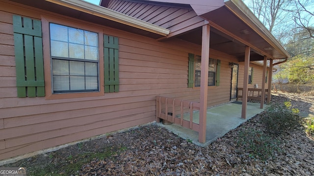 view of side of home with a patio