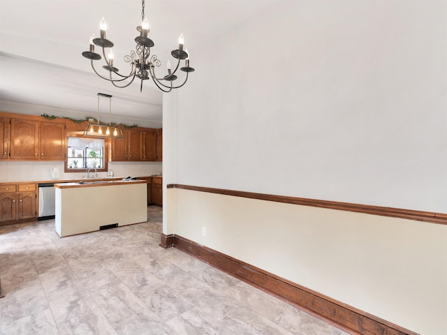 kitchen with a center island, an inviting chandelier, sink, hanging light fixtures, and stainless steel dishwasher