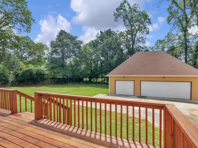 wooden terrace with a lawn, an outbuilding, and a garage