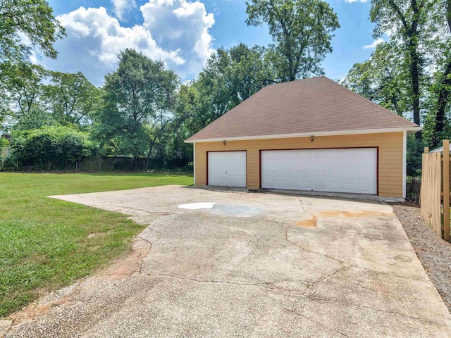 garage with a yard