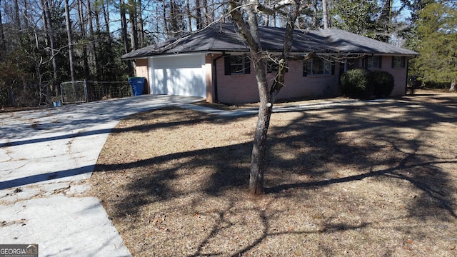 view of side of property featuring a garage