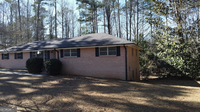 back of property featuring a lawn