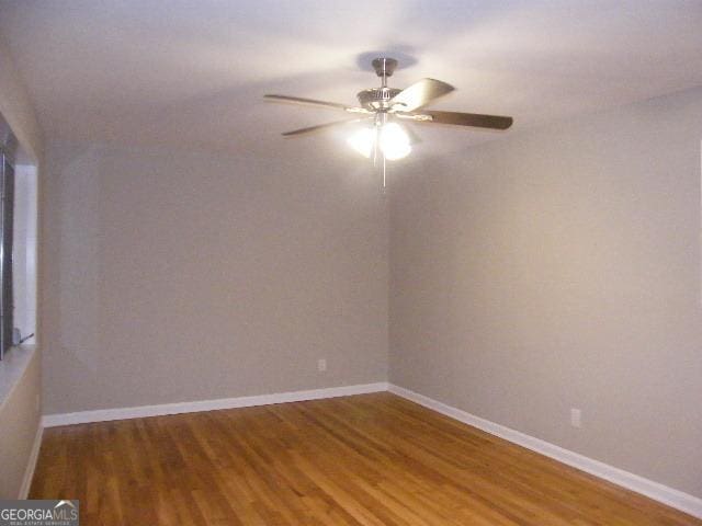 unfurnished room featuring hardwood / wood-style flooring and ceiling fan