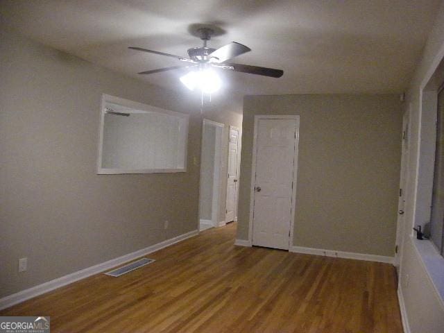 unfurnished bedroom with hardwood / wood-style flooring and ceiling fan