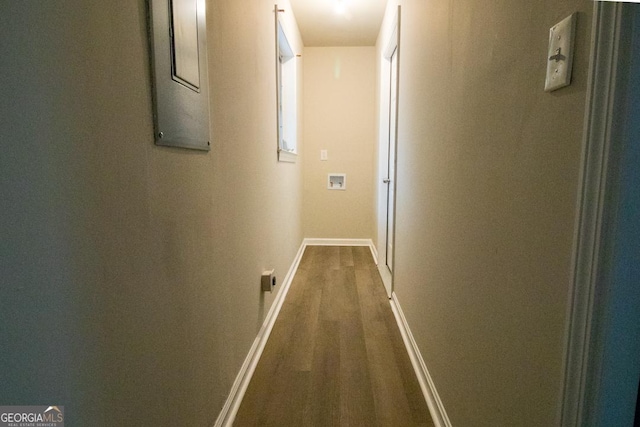 hallway with hardwood / wood-style flooring