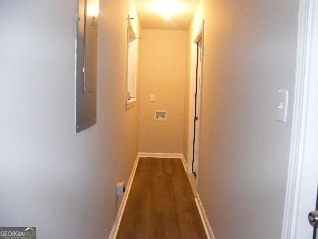 hallway with dark wood-type flooring