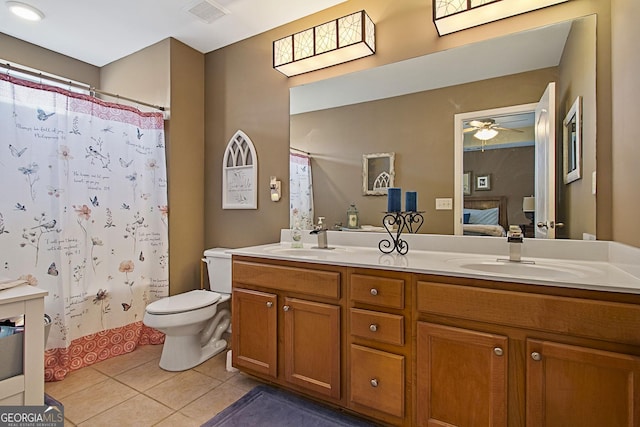 bathroom with a shower with shower curtain, ceiling fan, toilet, tile patterned floors, and vanity