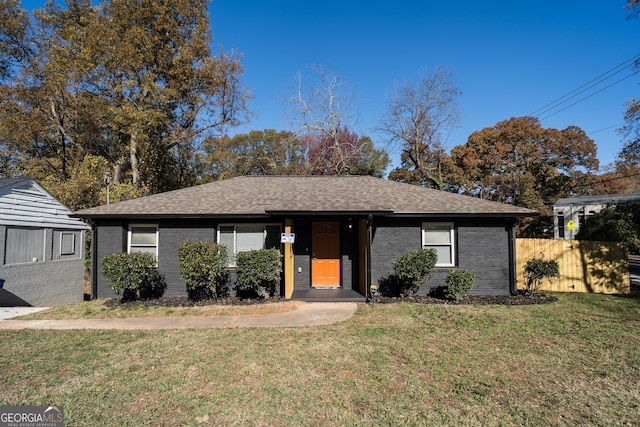 single story home with a front yard