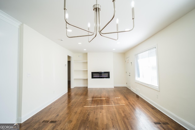 unfurnished living room with dark hardwood / wood-style flooring