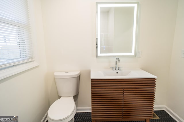 bathroom with vanity and toilet