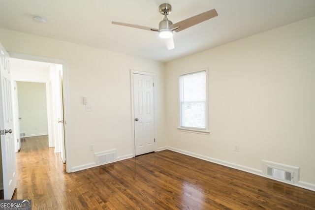 unfurnished bedroom with dark hardwood / wood-style floors and ceiling fan