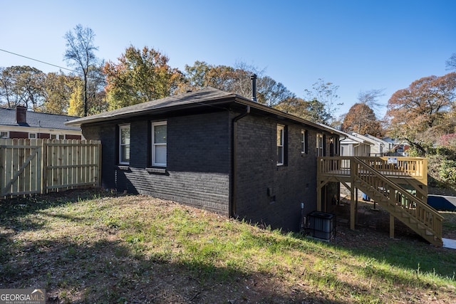 back of property featuring a deck