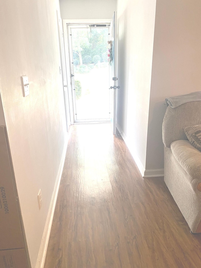 corridor featuring dark hardwood / wood-style floors