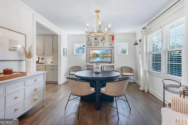 dining space with a notable chandelier and dark hardwood / wood-style floors