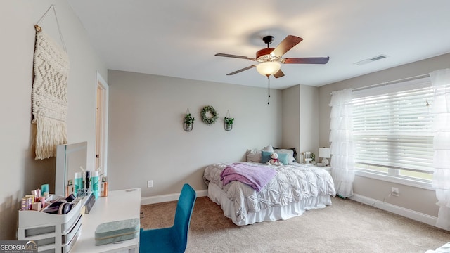 carpeted bedroom featuring ceiling fan