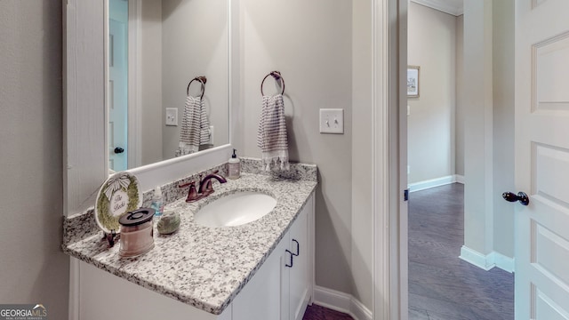 bathroom featuring hardwood / wood-style floors and vanity