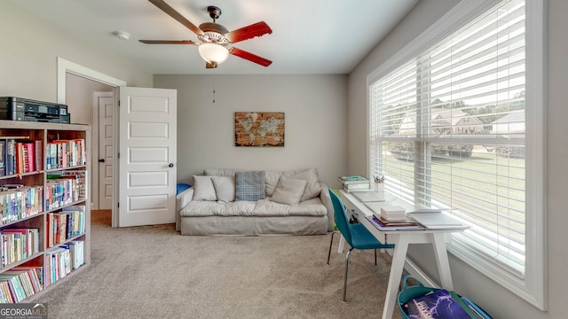 carpeted office with ceiling fan