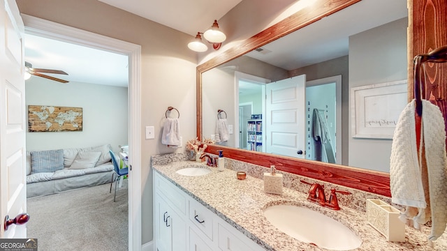 bathroom with ceiling fan and vanity