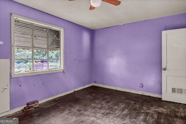 unfurnished room featuring dark hardwood / wood-style flooring and ceiling fan