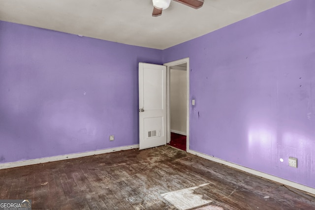 unfurnished room with hardwood / wood-style floors and ceiling fan