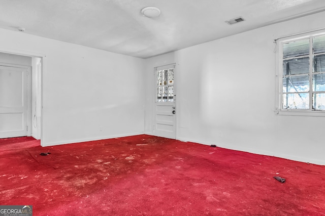 spare room featuring carpet floors