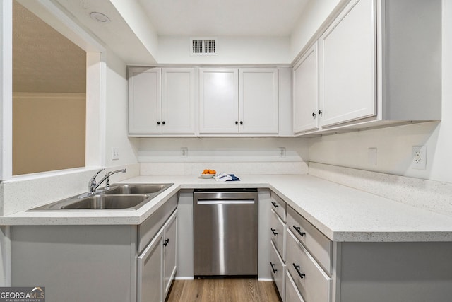 kitchen with wood-type flooring, dishwasher, and sink