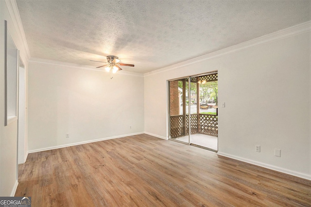 empty room with ornamental molding, ceiling fan, a textured ceiling, and light wood-type flooring