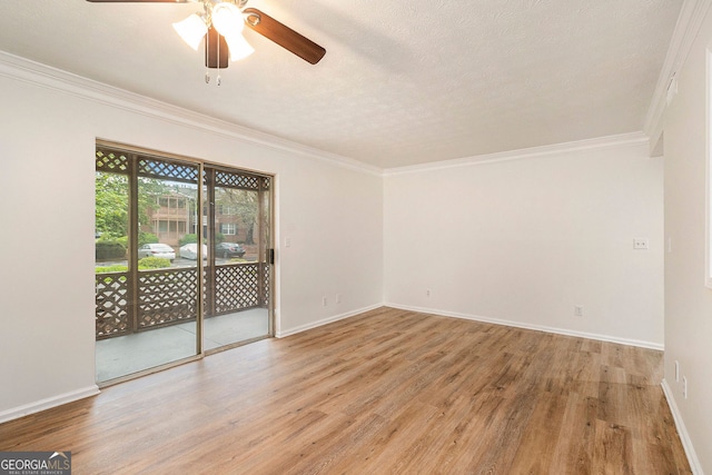 empty room with crown molding, wood-type flooring, ceiling fan, and a textured ceiling