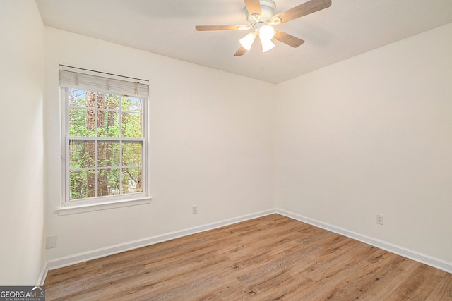 unfurnished room with ceiling fan and light wood-type flooring