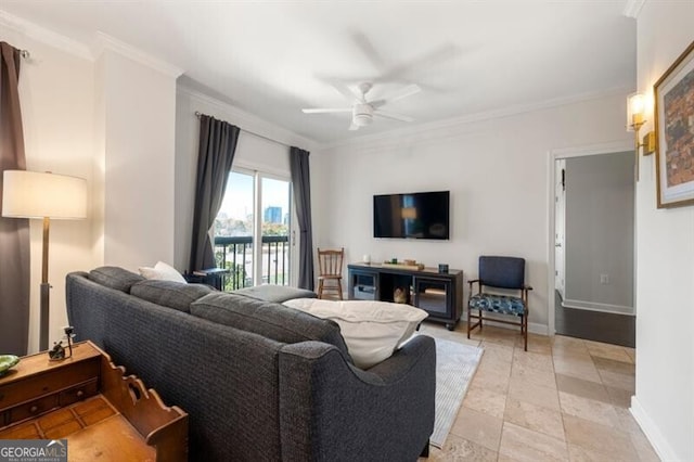 living room with baseboards, a ceiling fan, and ornamental molding