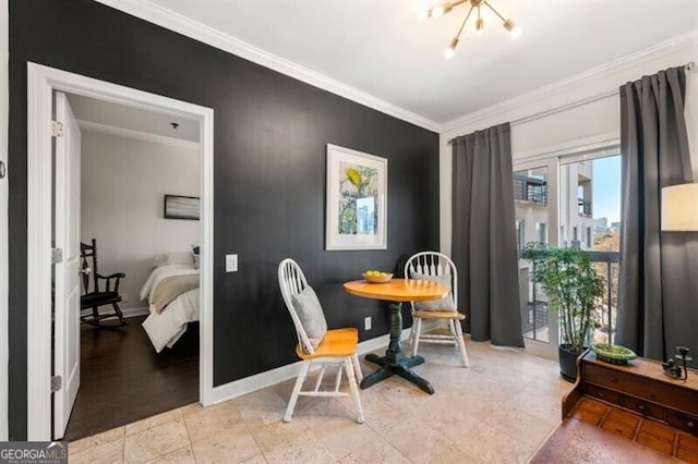 dining area featuring crown molding and baseboards