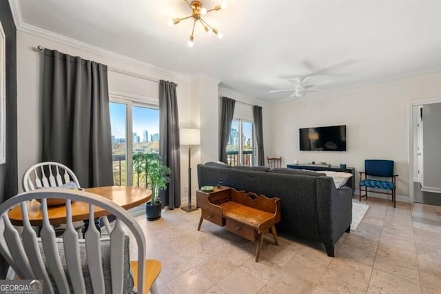 living area with baseboards, crown molding, and ceiling fan with notable chandelier