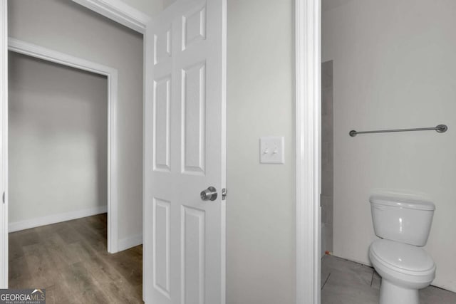 2005 Washington St, Savannah, GA 31406 - bathroom with toilet, wood finished floors, and baseboards